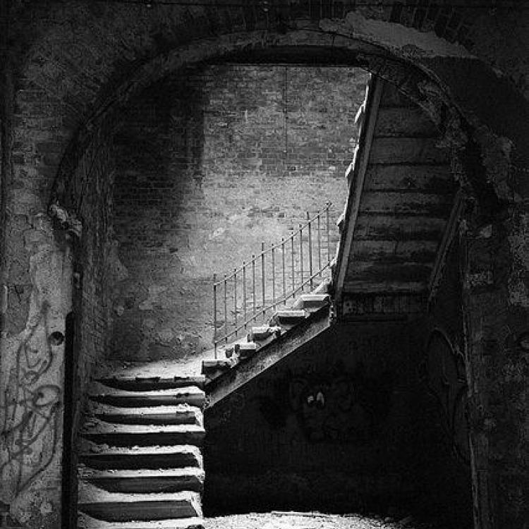 Although this abandoned hospital is in Beelitz Heilstaetten, Germany, in my mind Kelby is guided to the bottom of a rotting wooden stairway.